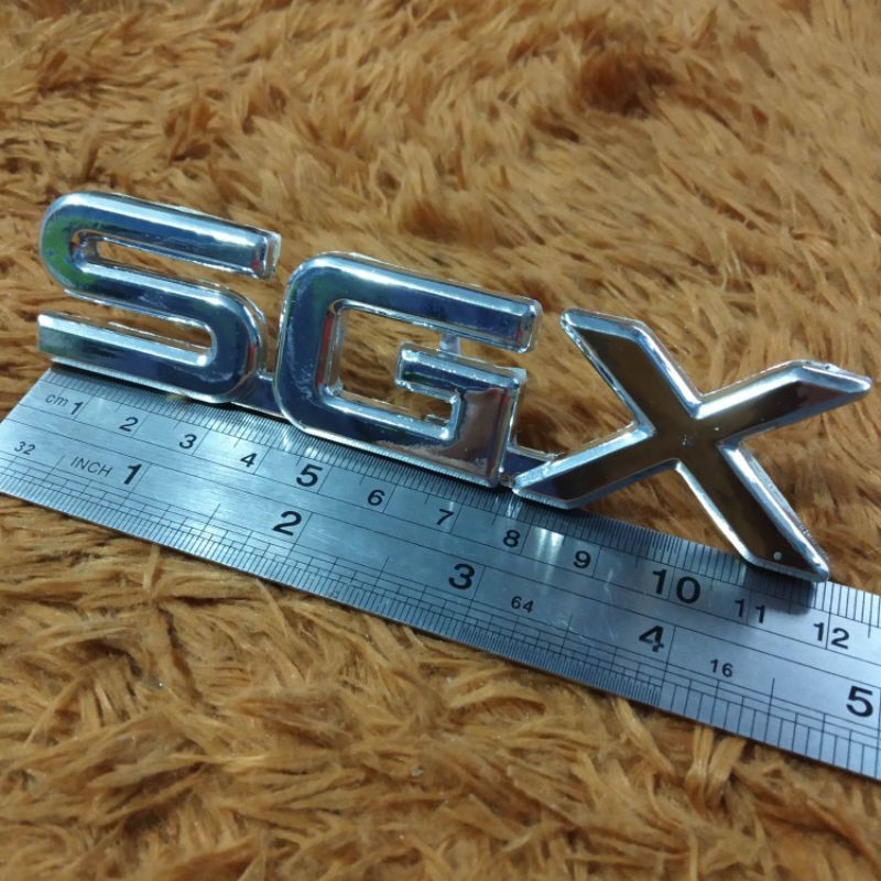 Emblem SGX Kijang Kapsul