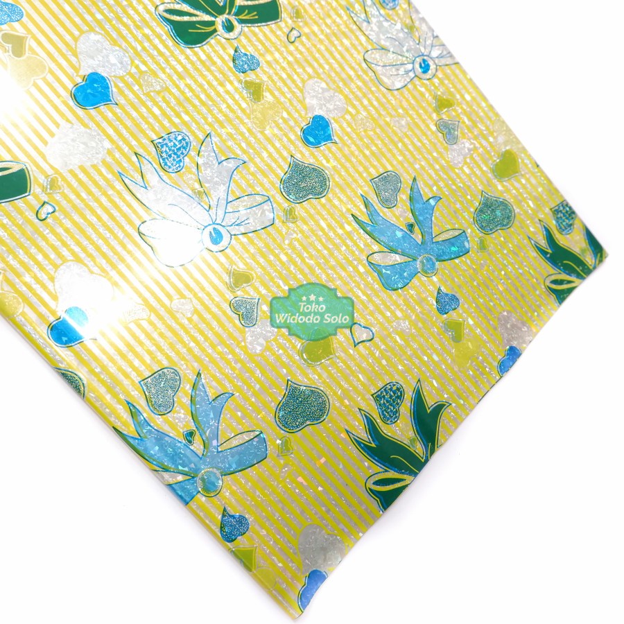 

Plastik Kado Hologram Kuning Pita 50x65cm - 1 Ons Isi 11 Lembar