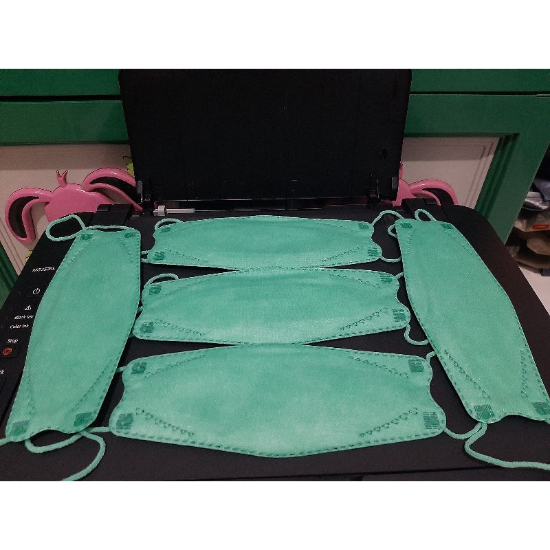 MASKER KF94 WARNA HIJAU TOSCA  PROMO 1 PACK ISI 20 PCS (KEMASAN PLASTIK)
