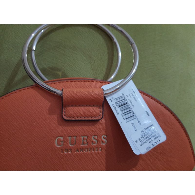 tas guess orange