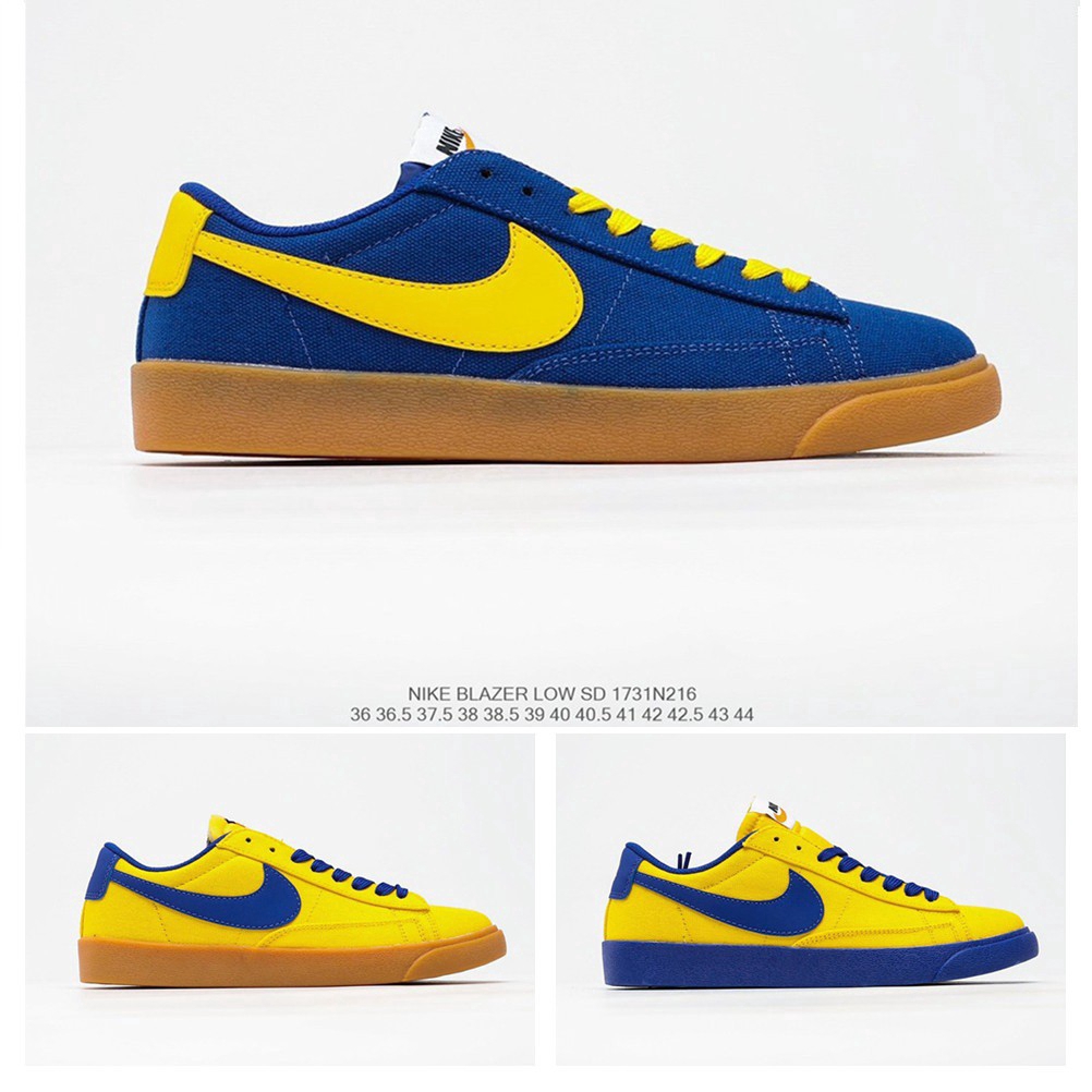 navy blue and yellow sneakers