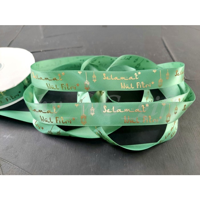 

Pita Idul Fitri -Satin Emboss Emas Motif A ;Lebar 3.8 cm; Hijau Tosca