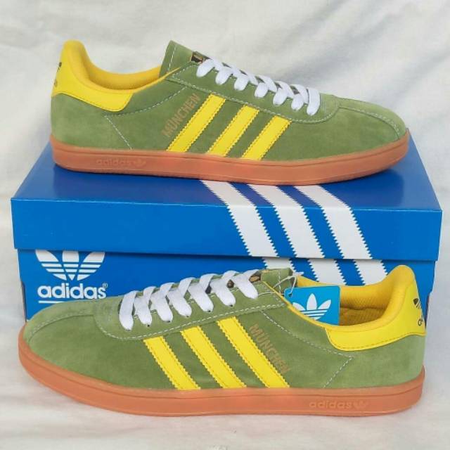purple and yellow adidas munchen