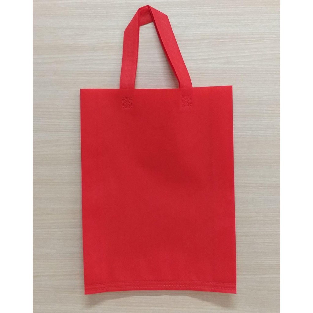 

GOODIE BAG SPUNBOND HANDLE 30x40 / Tas Belanja Murah / Kantong Belanja / Souvenir (Warna Merah)