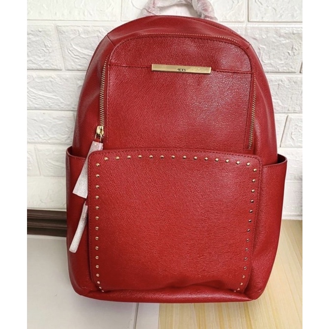 Tumi backpack red leather with studed gold