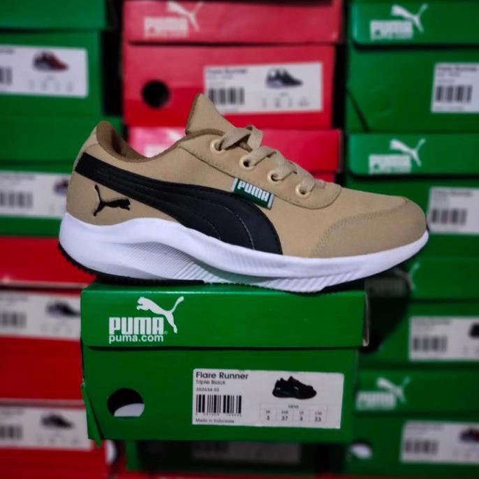 grey and green puma shoes