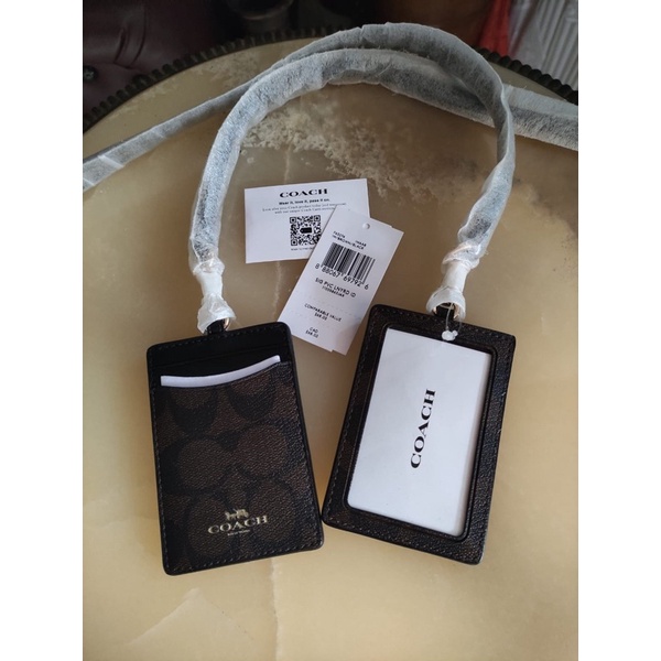 

coach lanyard sign brown black