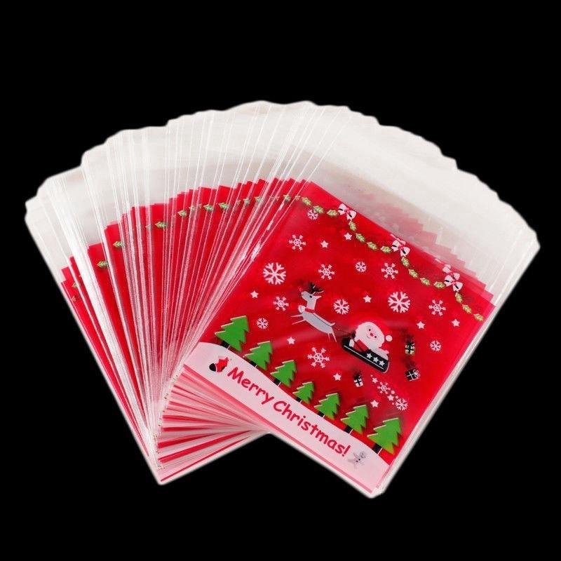 100pcs Kantong Plastik Cellophane Motif Natal Dengan Perekat Untuk Permen / Kue Kering