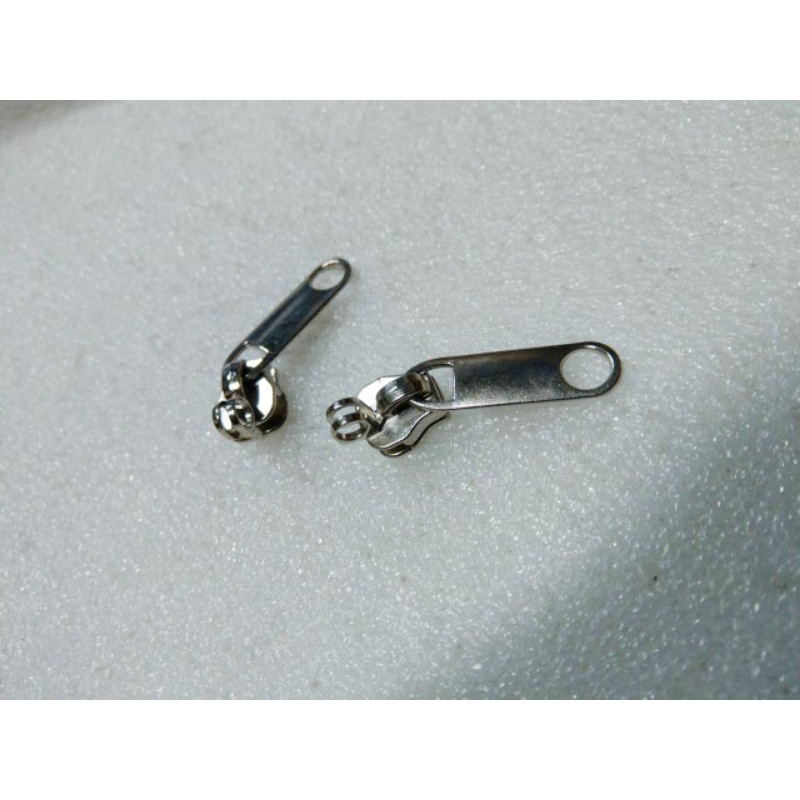 kepala resleting no.8 TANDUK KUNCI. untuk gigi coil plastik grosir 100 pcs dan 350 pcs..