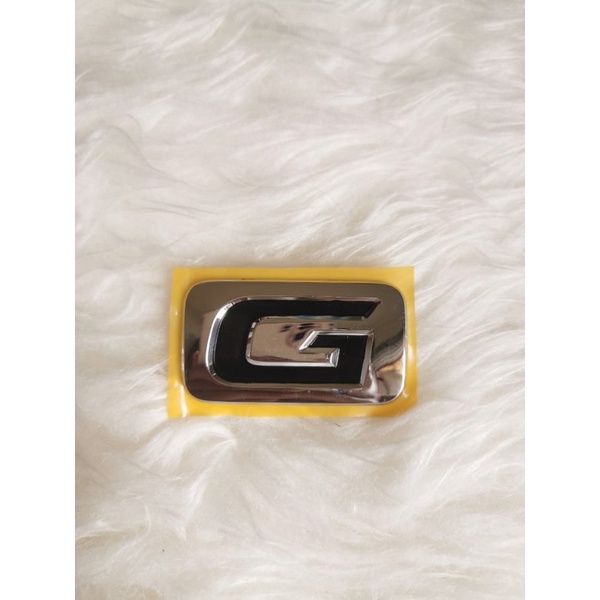 Emblem mobil innova huruf G chrome