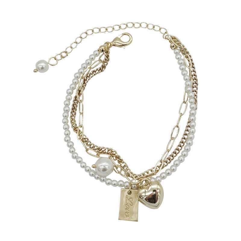 Gelang Mutiara Multilayer Dengan Liontin Hati Warna Emas Gaya Vintage Untuk Wanita