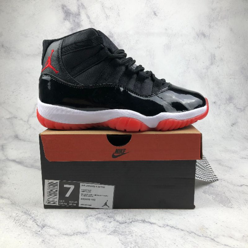 solid black jordan 11