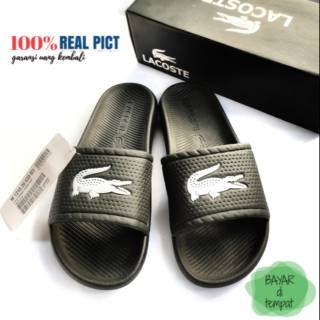 black and gold lacoste slides