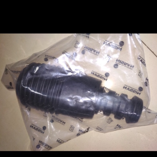 Karet boot shock depan livina