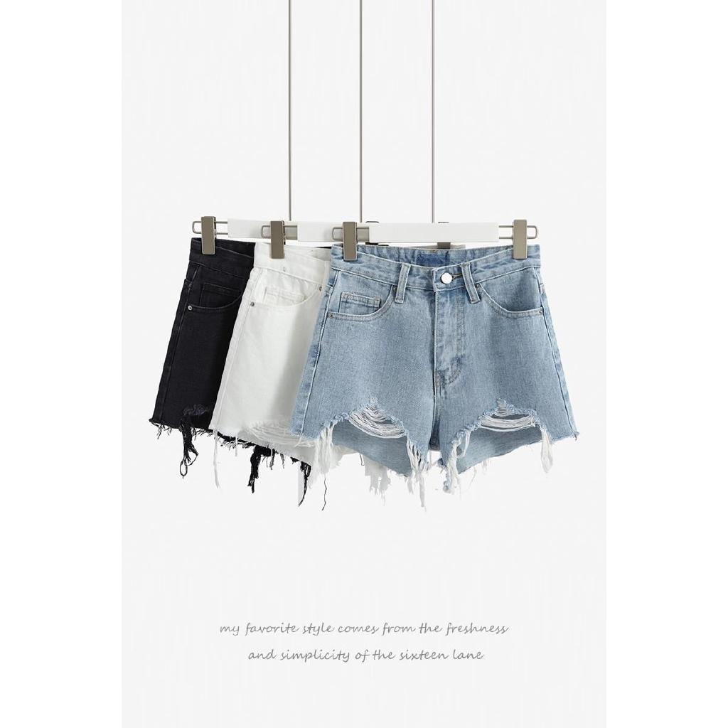 Celana Pendek Model High Waist Longgar Desain Lubang Bahan Celana Pendek Model High Waist Longgar Desain Lubang Bahan