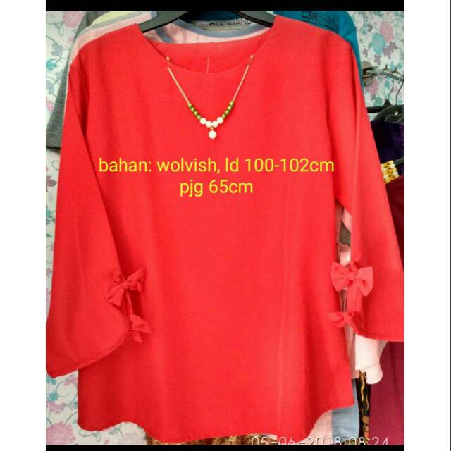 

Blus merah kerja pita