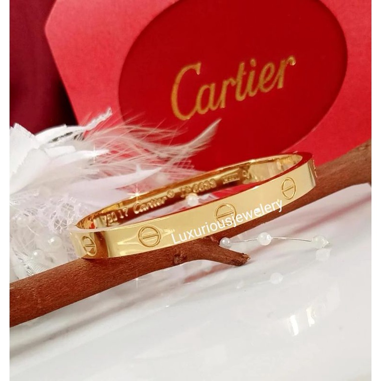 Gelang bangle tittanium ada grafir logo