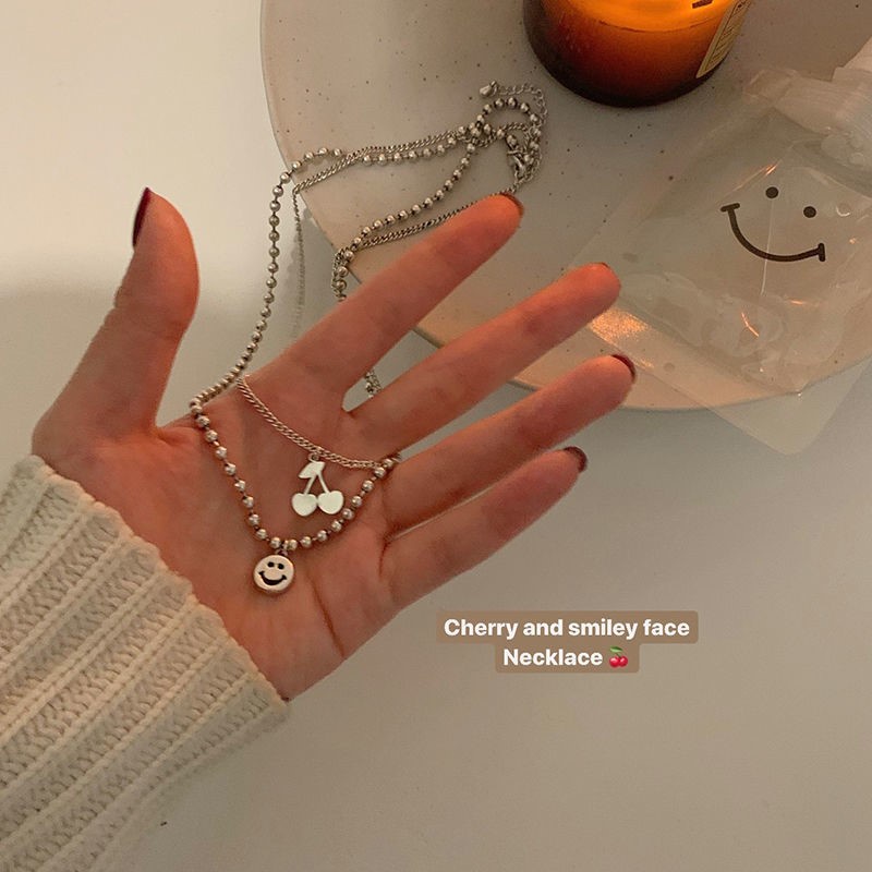 Roselife 2Pcs / Set Kalung Rantai Stainless Steel Liontin Buah Ceri Smiley Face Untuk Wanita