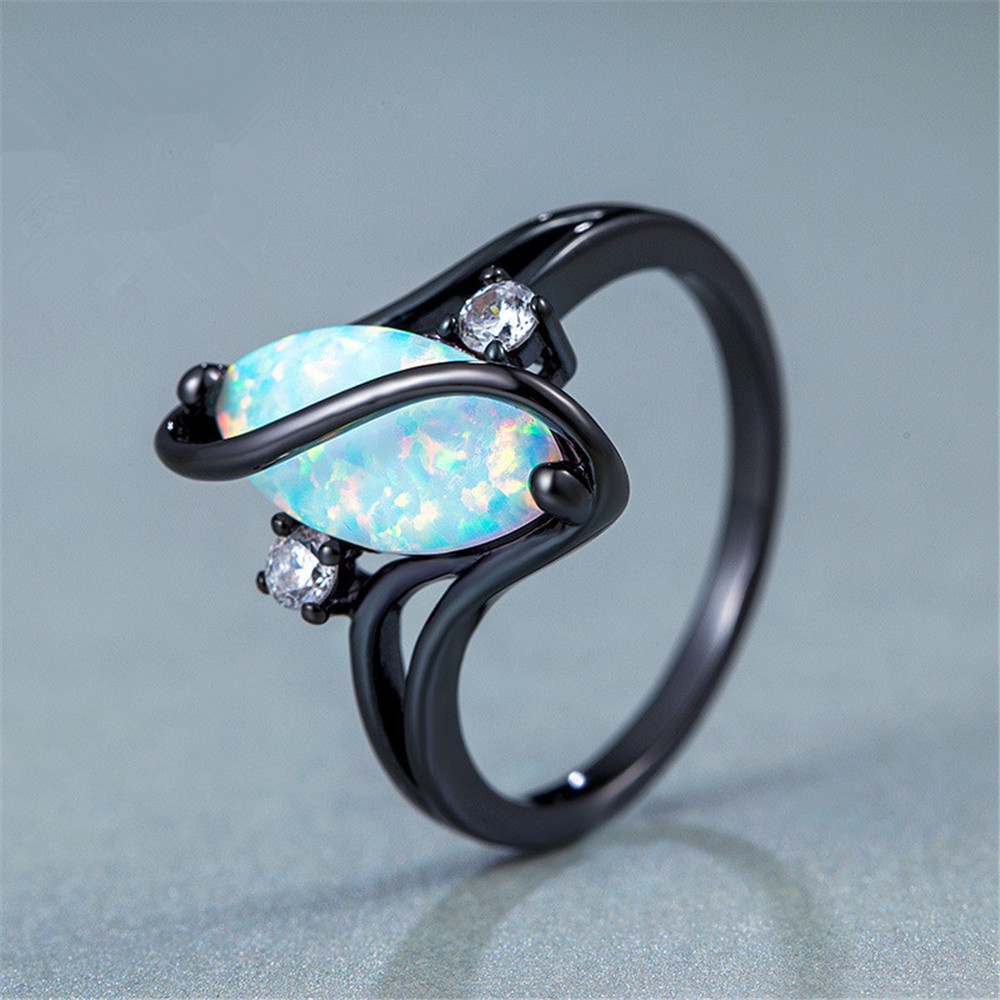 S-shaped diamond blue black gold horse eye opal ring