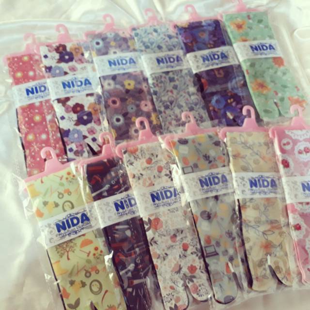 Kaos kaki printing tapak hitam