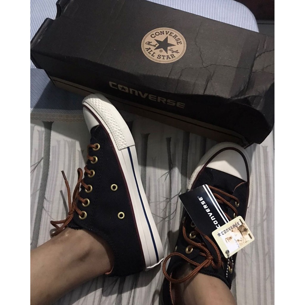 tan and black converse