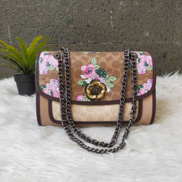 

Co Parker in blocked signature canvas with blossom print