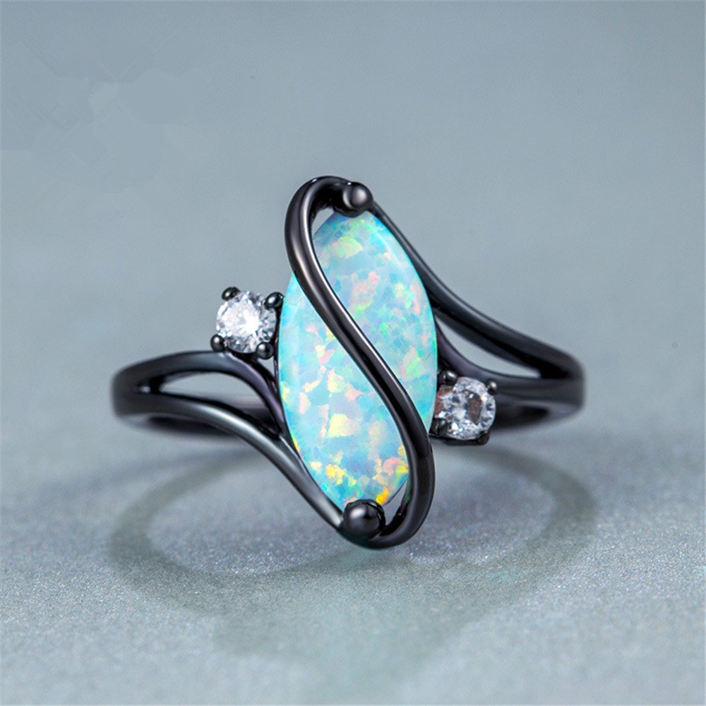 S-shaped diamond blue black gold horse eye opal ring