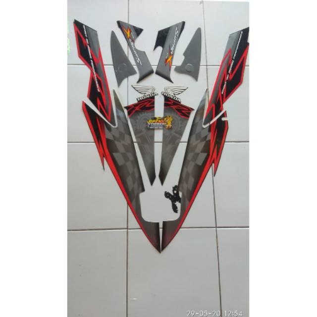 Striping,stiker body motor SUPRA X125 TAHUN 2009