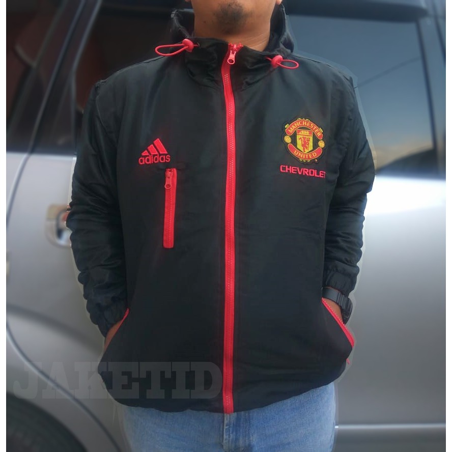 JAKET PRIA MANCHESTER UNITED MU PARASUT ANTI AIR TAHAN ANGIN MOTOR SPORTY WARNA HITAM