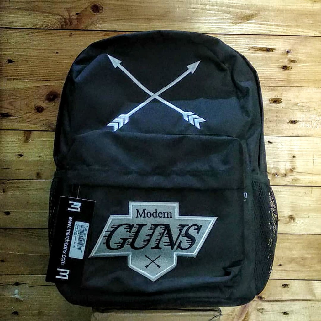 

MODERN GUNS BACKPACK TAG MERCHONS