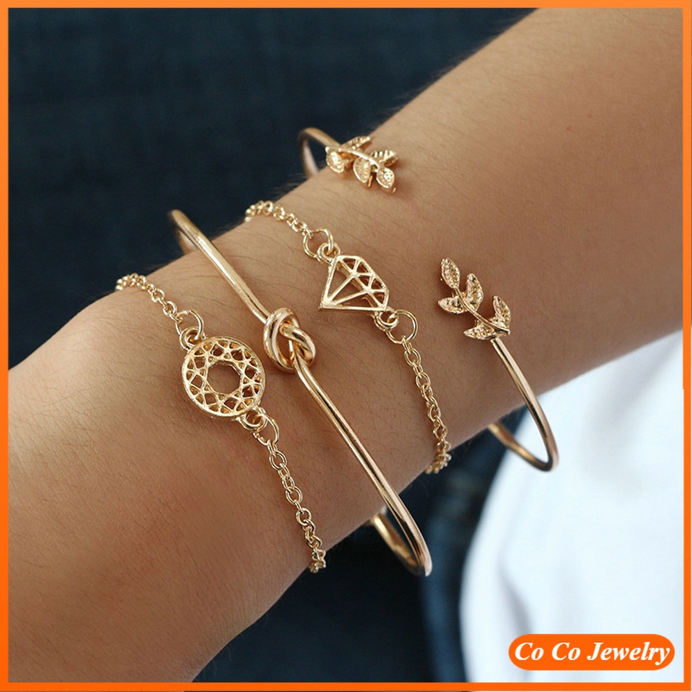 4pcs / Set Gelang Bangle Desain Daun Hollow Hias Berlian Imitasi Warna Emas Untuk Wanita