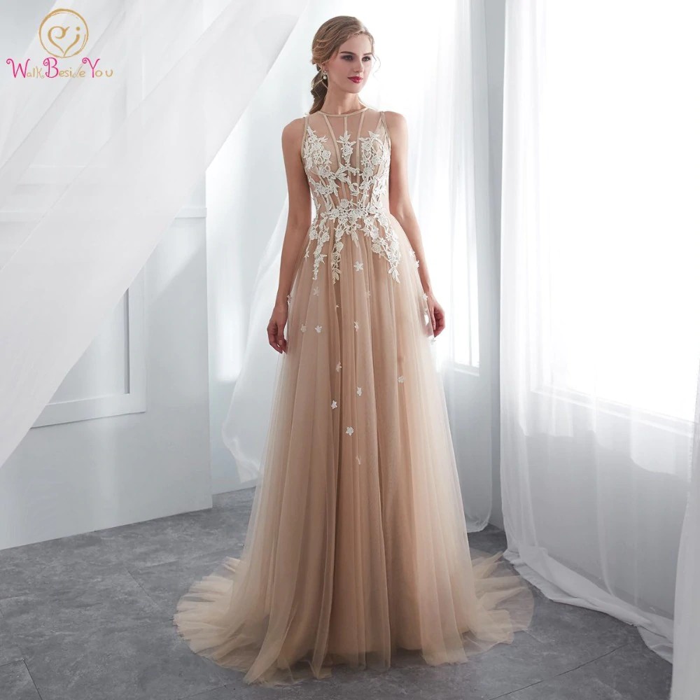 champagne colored mermaid dress with transparent shoulders