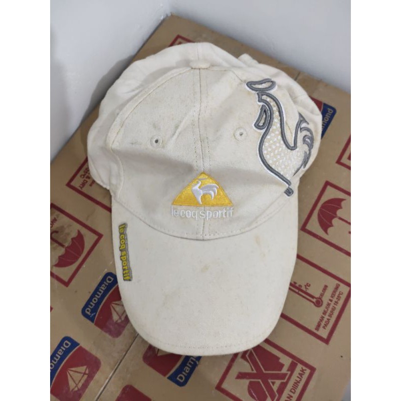 Topi Le Coq Sportif