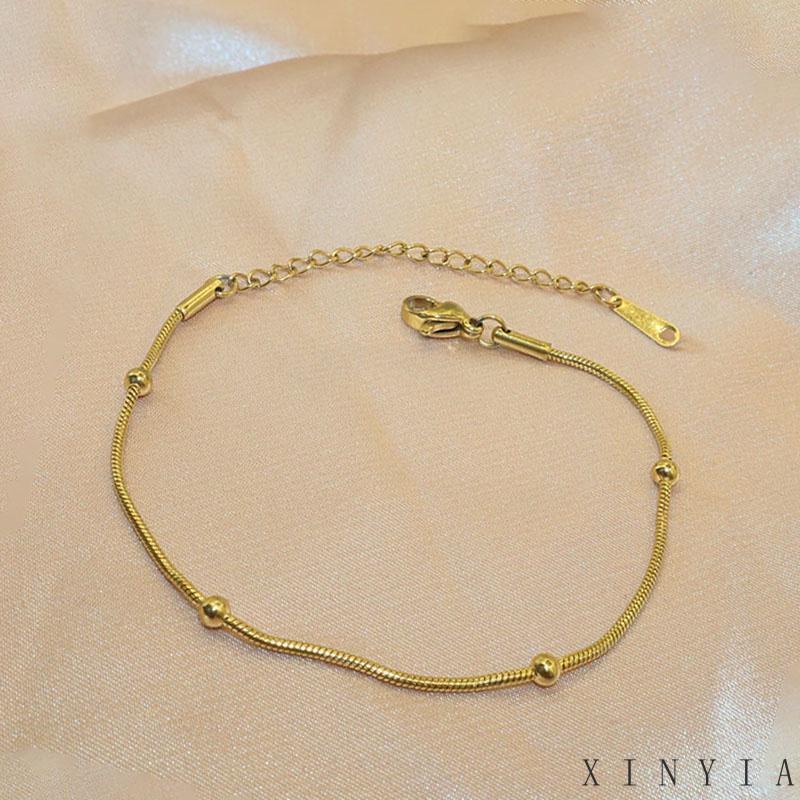 Xia.id Gelang Tangan Titanium Steel Desain Tulang Ular Hias Manik Bulat Untuk Wanita