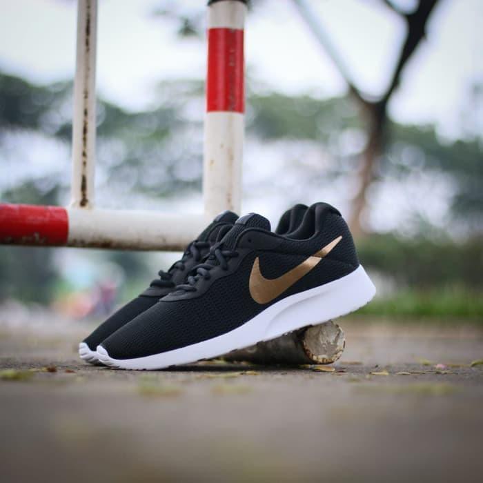 nike tanjun niño negras