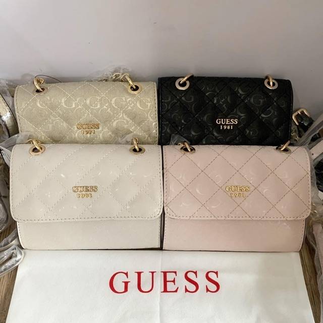 Tas guess holo clutch bag