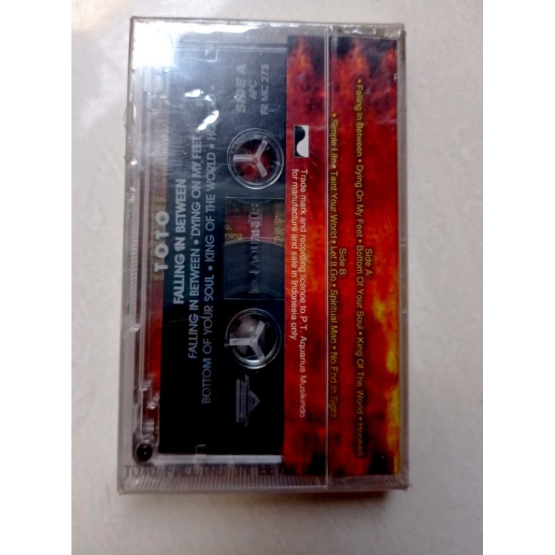 kaset ori TOTO FALLING IN BETWEEN kondisi segel (new old stock)