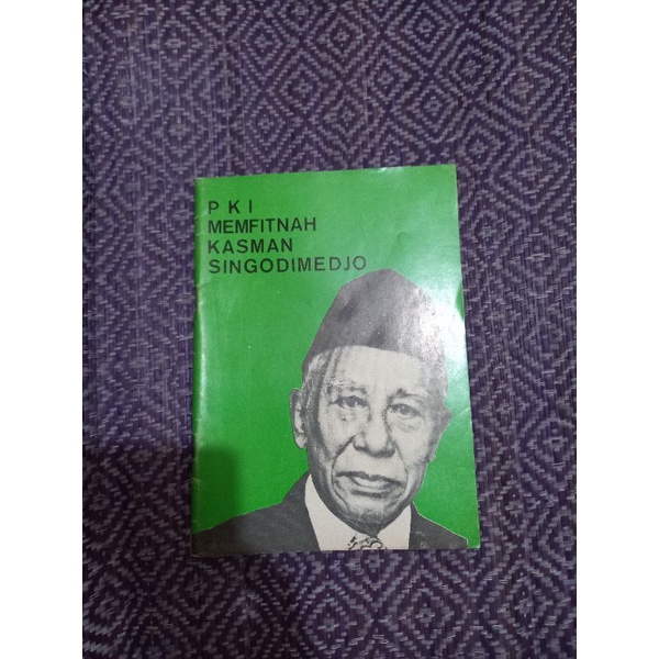 PKI MEMFITNAH KASMAN SINGODIMEDJO