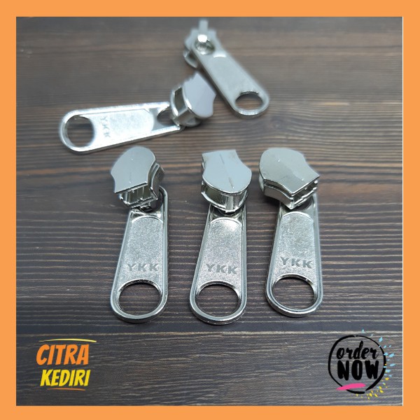 Kepala Resleting YKK lubang bulat