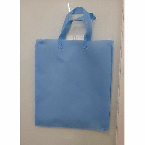 

Tas Press Spunbound Tali Goodie Bag Tas Belanja Warna Biru Baby Blue 38 cm x 45 cm