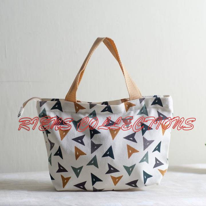 RIENS COLLECTIONS. HANDBAG / TAS JINJING BAHAN KANVAS MOTIF MATA PANAH