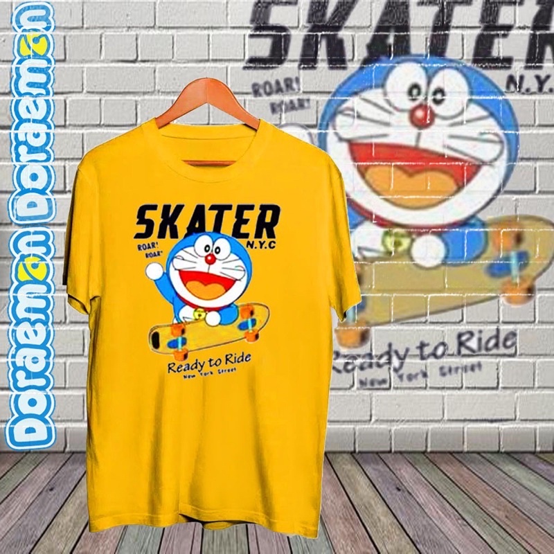 BAJU KAOS T SHIRT DORAEMON SKATER KUNING ANIME JEPANG PRIA WANITA COWOK CEWEK UNISEX