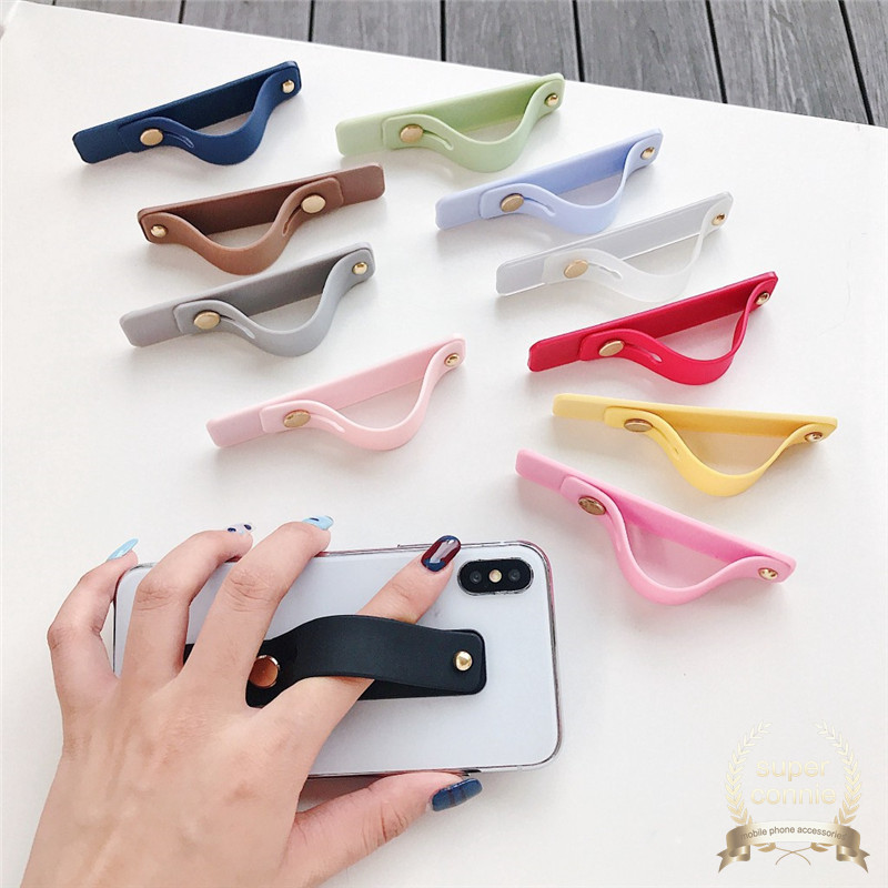 Stand Holder Smartphone Universal Bahan Silikon Dengan Strap Pergelangan Tangan