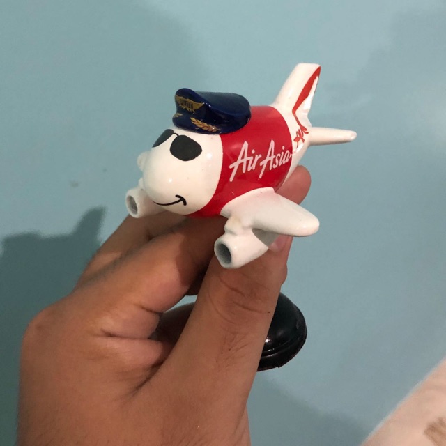 Miniatur pesawat per air Asia karikatur