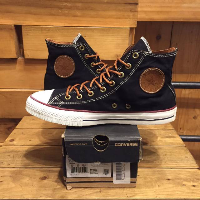 tan and black converse