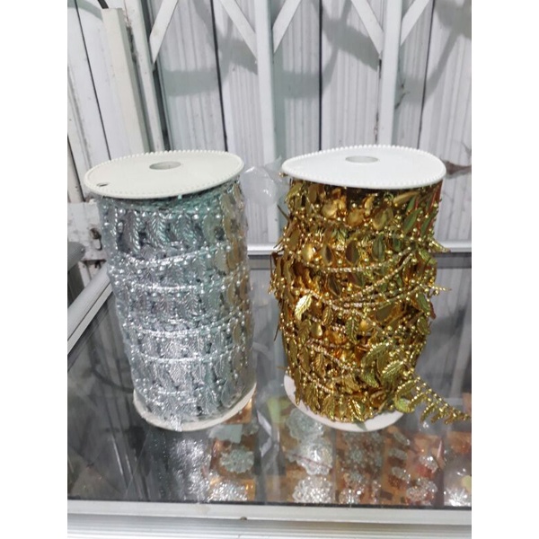 renda daun plastik gold/silver