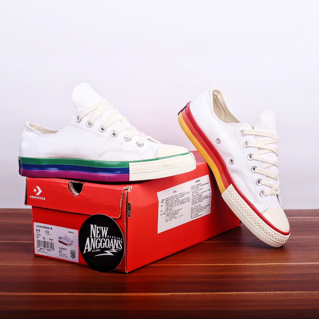 white converse with rainbow