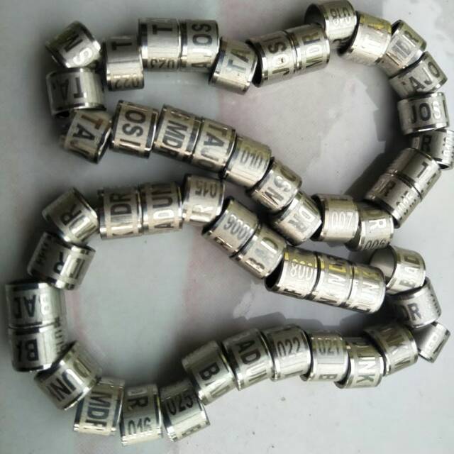 Ring merpati baja ukir kuat anti karat.bisa pesan nama no hp ,harga per set isi 25 biji
