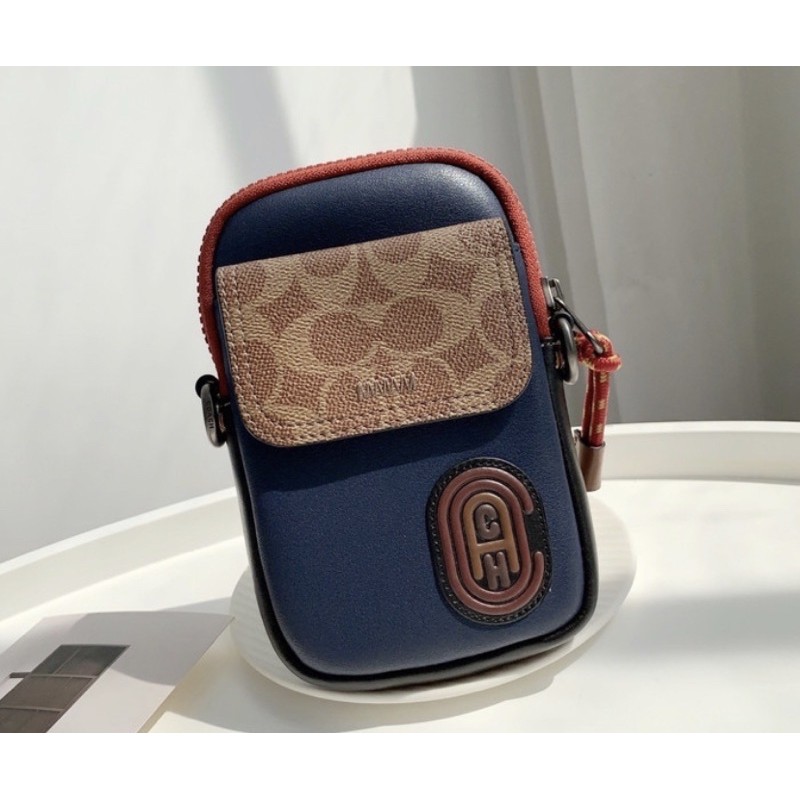 COACH PACER POUCH IN COLOURBLOCK SIGNATURE CANVAS WITH PATCH