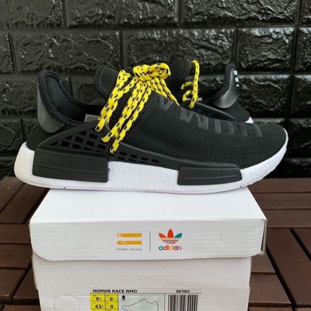 nmd human race black yellow laces